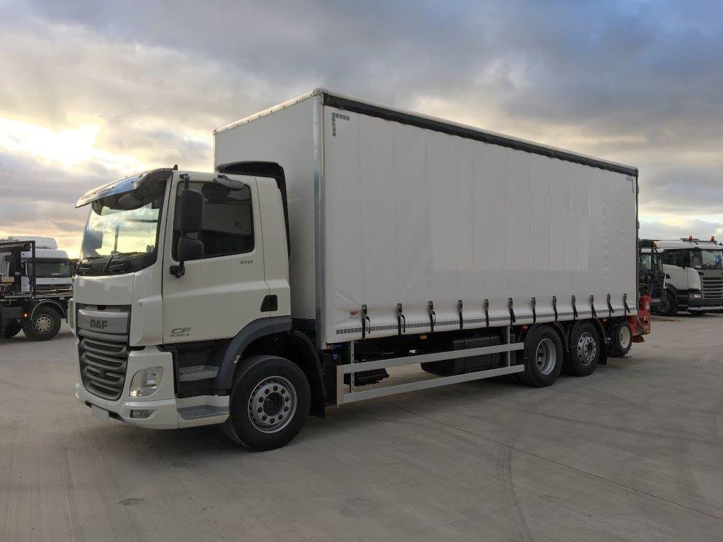 left side view of white 2019 daf curtainsider truck