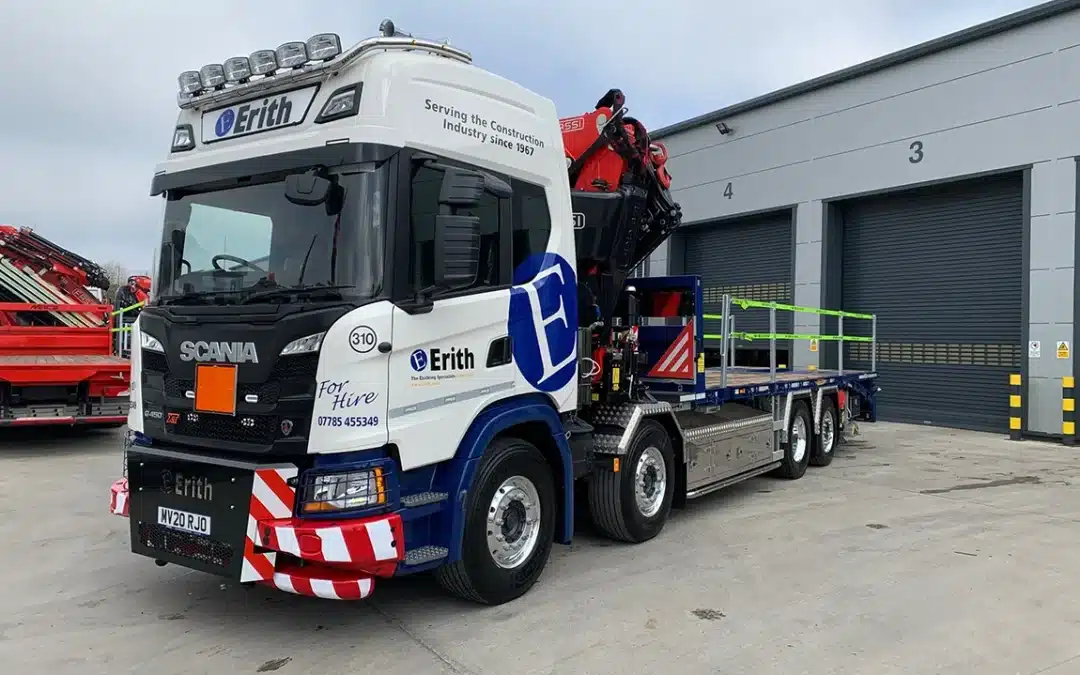 SCANIA G450 WITH FASSI F710, FRONT LEGS AND CHEESE WEDGE BEAVERTAIL BODY